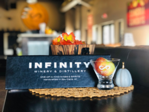 An Infinity Winery Banner and a Glass